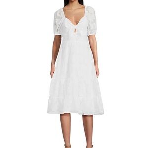 Xtraordinary | white floral dress | puffy sleeves | tie peekaboo front | size XS